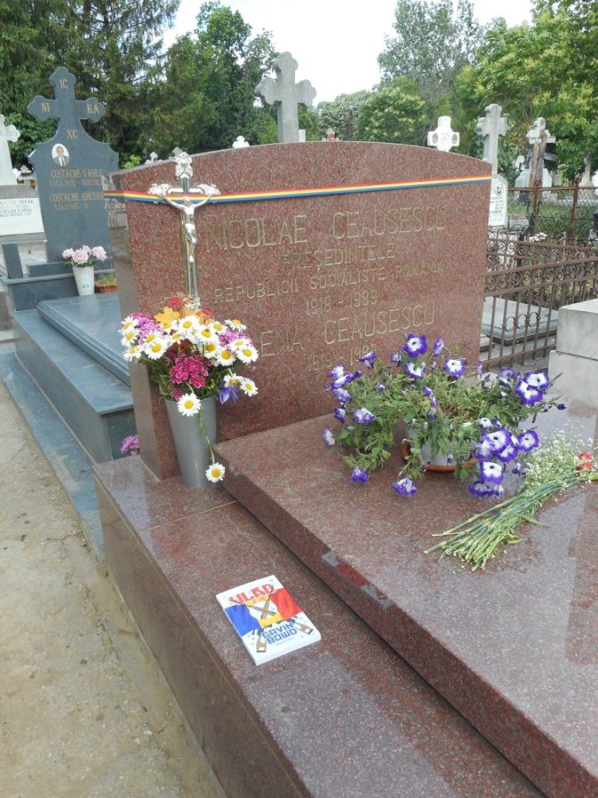 Vlad the book lying next to the headstones of the Ceausescus in Bucharest